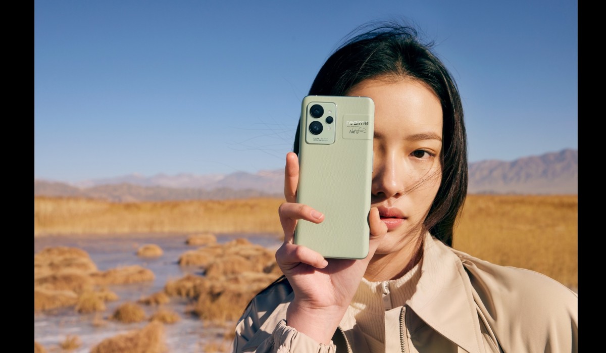 Girl holding Realme GT 2 Pro in promotional image